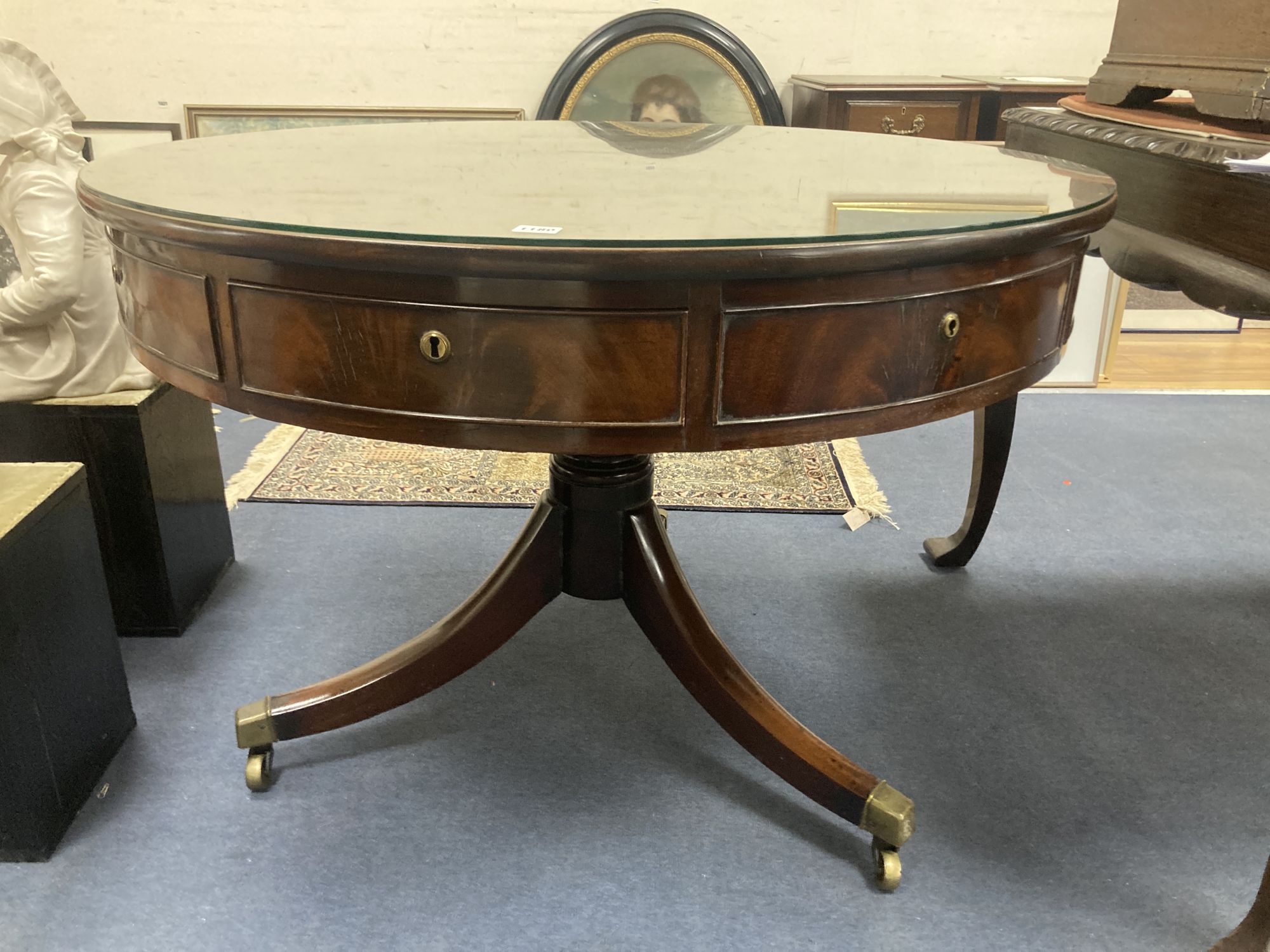 A Regency mahogany drum top library table,